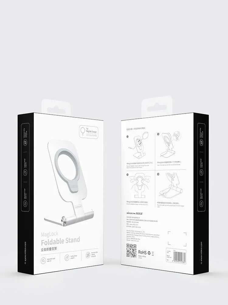 NILLKIN silver foldable aluminium alloy magnetic wireless charging stand for iPhone 12 Mini and 12 Pro Max on a desk