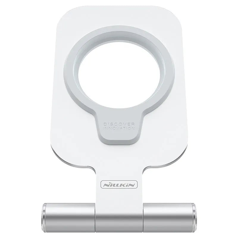 NILLKIN silver foldable aluminium alloy magnetic wireless charging stand for iPhone 12 Mini and 12 Pro Max on a desk