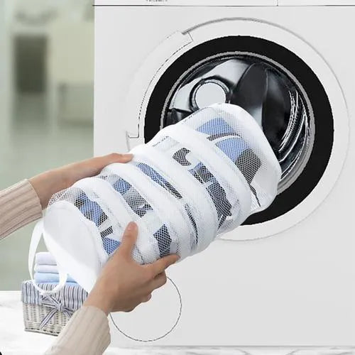Shoe washing bag in blue mesh with foam padding, hidden zipper, and side lanyards for machine washing