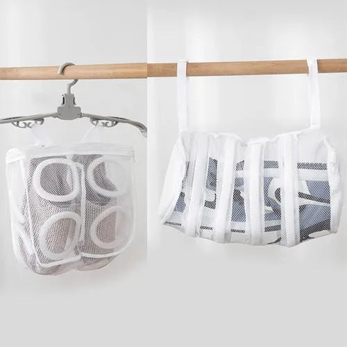 Shoe washing bag in blue mesh with foam padding, hidden zipper, and side lanyards for machine washing