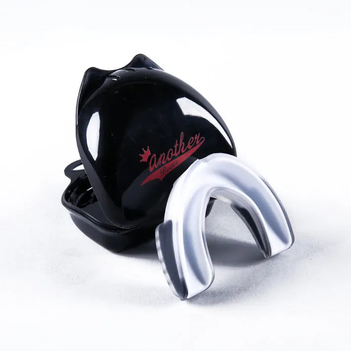 Double-sided silicone mouth guard in black and white for boxing basketball teeth protection, size S