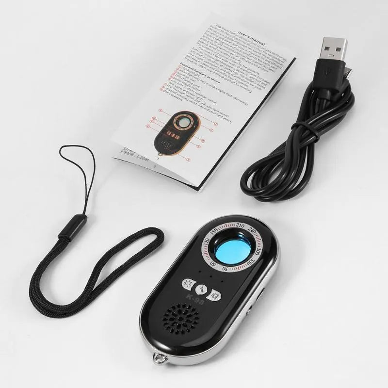 Small black rectangular wireless signal detector and vibration alarm unit on a white background.
