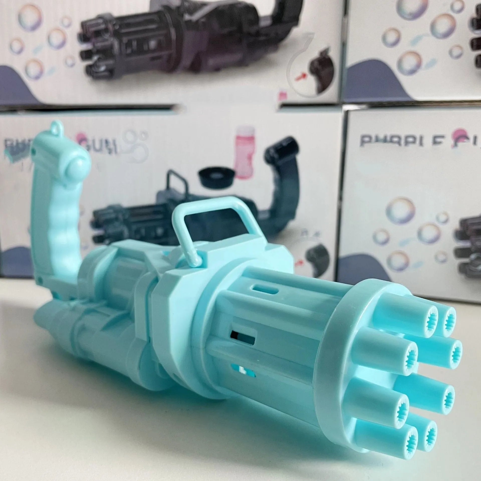 Kids bubble machine gun toy in pink, gold, or black colours with battery compartment and bubble solution