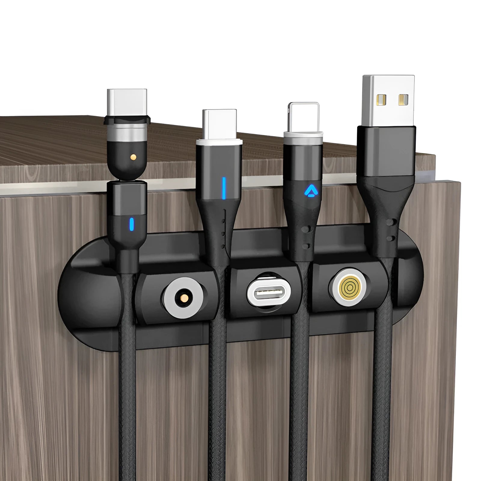 Black soft plastic desktop charging stand with adhesive base for organising cables.