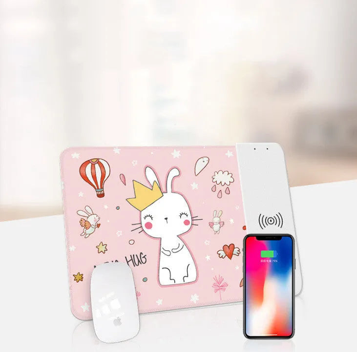 Black wireless charging mouse pad with cartoon design, showing RGB lighting and USB cable.