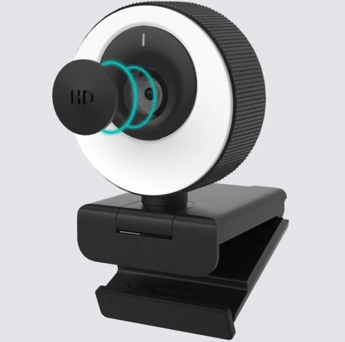 Black USB webcam with magnetic privacy cover on computer monitor