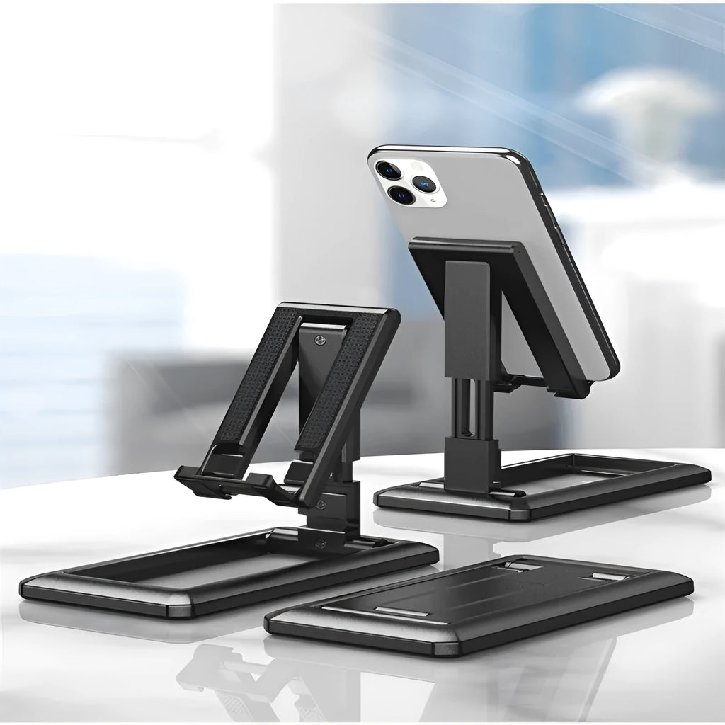 Retractable foldable mobile phone desktop stand in black on desk showing adjustable height and angle