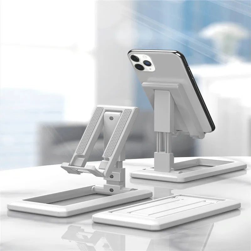 Retractable foldable mobile phone desktop stand in black on desk showing adjustable height and angle