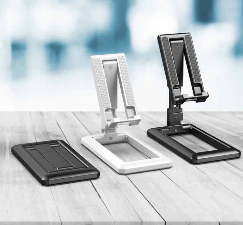 Retractable foldable mobile phone desktop stand in black on desk showing adjustable height and angle