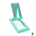 Retractable foldable mobile phone desktop stand in black on desk showing adjustable height and angle