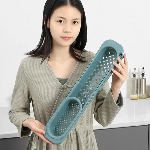 Adjustable telescopic sink rack organiser with drainage basket in kitchen sink