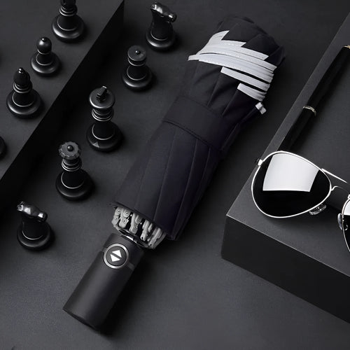 Automatic reverse umbrella with black canopy showing three-fold design and plastic non-slip handle