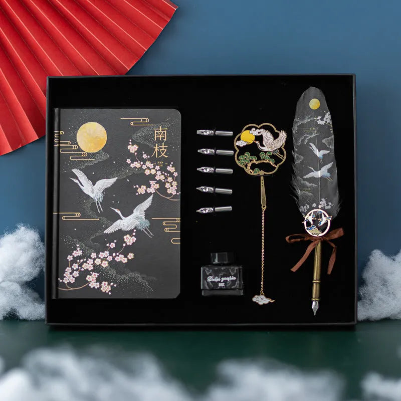 Chinese style metal feather pen set with notebook in gift box, showing feather detail.
