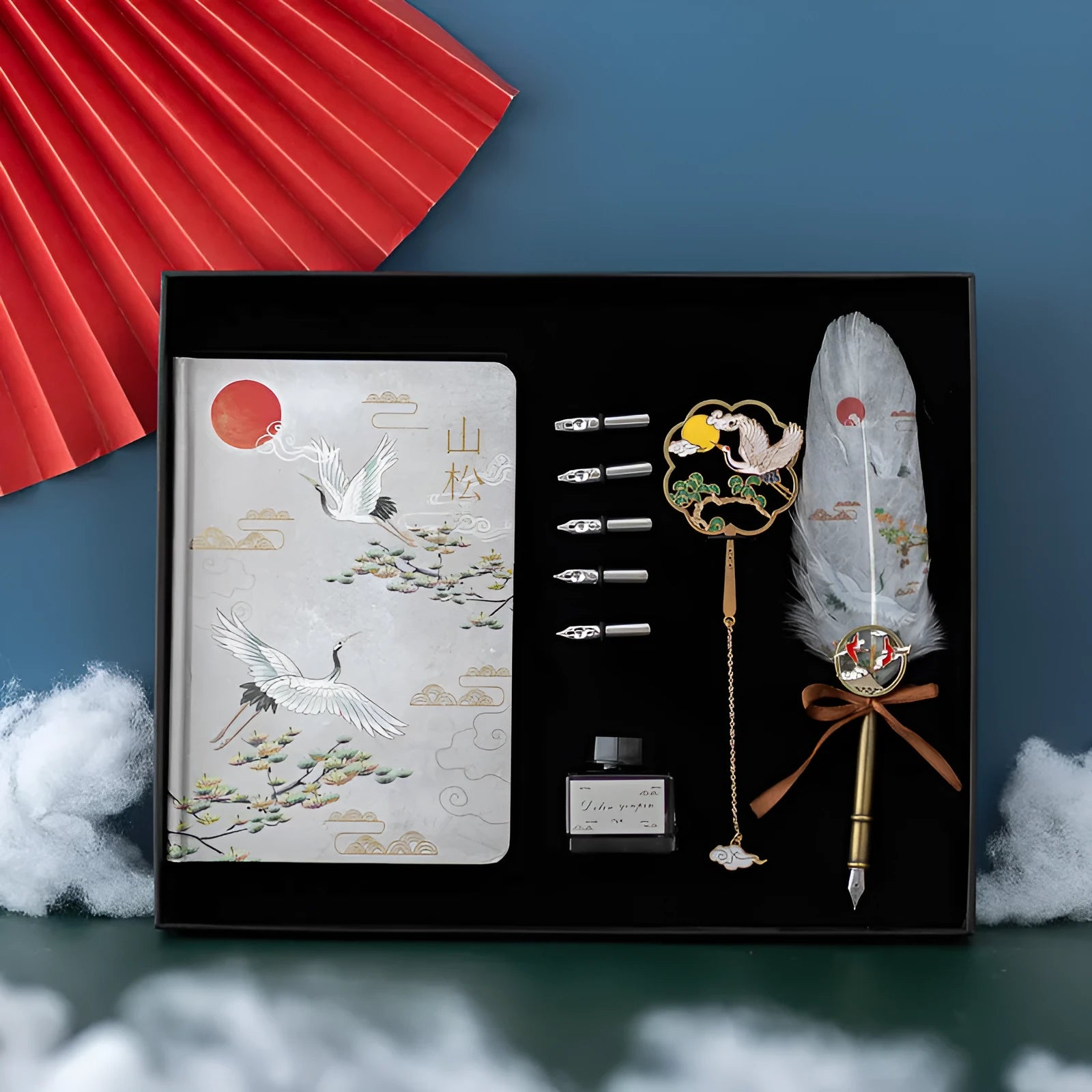 Chinese style metal feather pen set with notebook in gift box, showing feather detail.