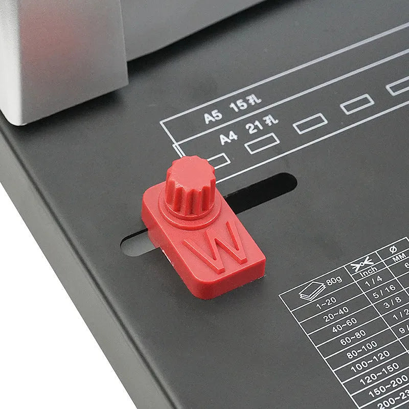White A4 manual comb binding machine with 21-hole clamp strip and 10-hole apron strip options on desk