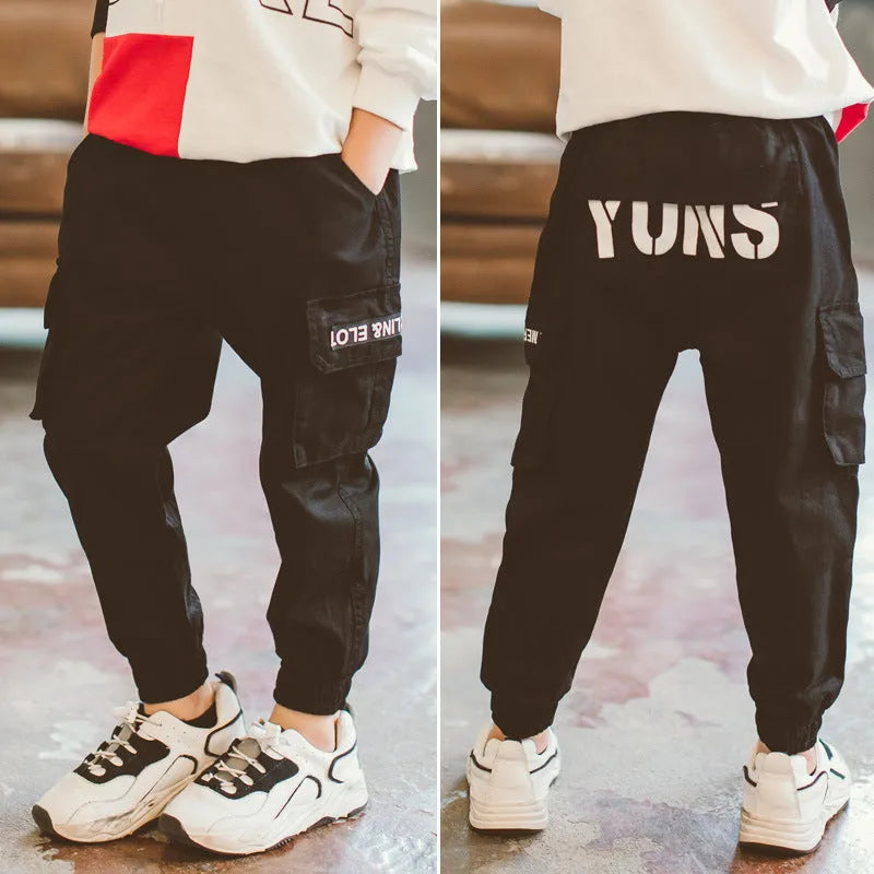 Boys' spring casual overalls with letter print and zip placket in black or army green, sizes 110 to 170.