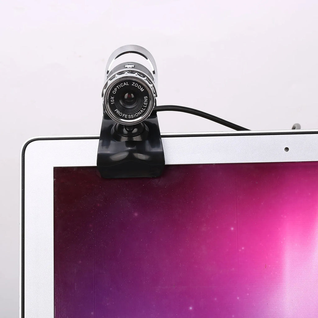Black notebook HD USB computer camera with manual focus lens and built-in microphone on a monitor