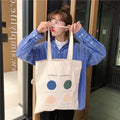 Women's canvas tote bag with geometric pattern print and double soft handles