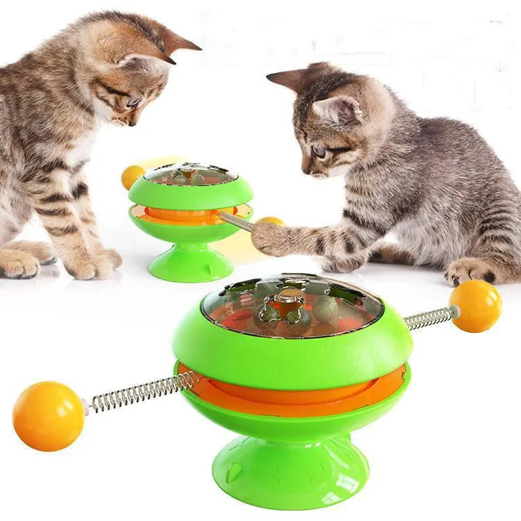 Rotatable suction cup cat toy with transparent top showing three catnip balls, in lake blue colour.