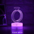 3D diamond ring design LED night light with colour-changing light on black background.
