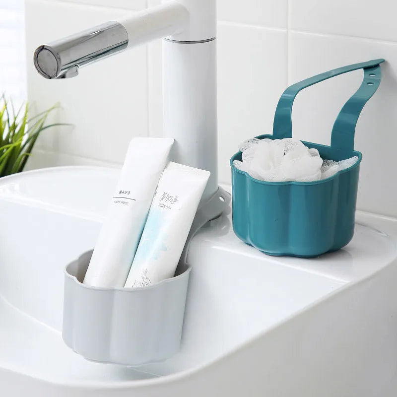 Nordic-style plastic sink drain basket in dark blue on a kitchen countertop.