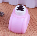 Plastic embossing device for children with star pattern, 3 cm size, on white background