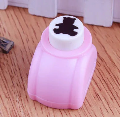 Plastic embossing device for children with star pattern, 3 cm size, on white background
