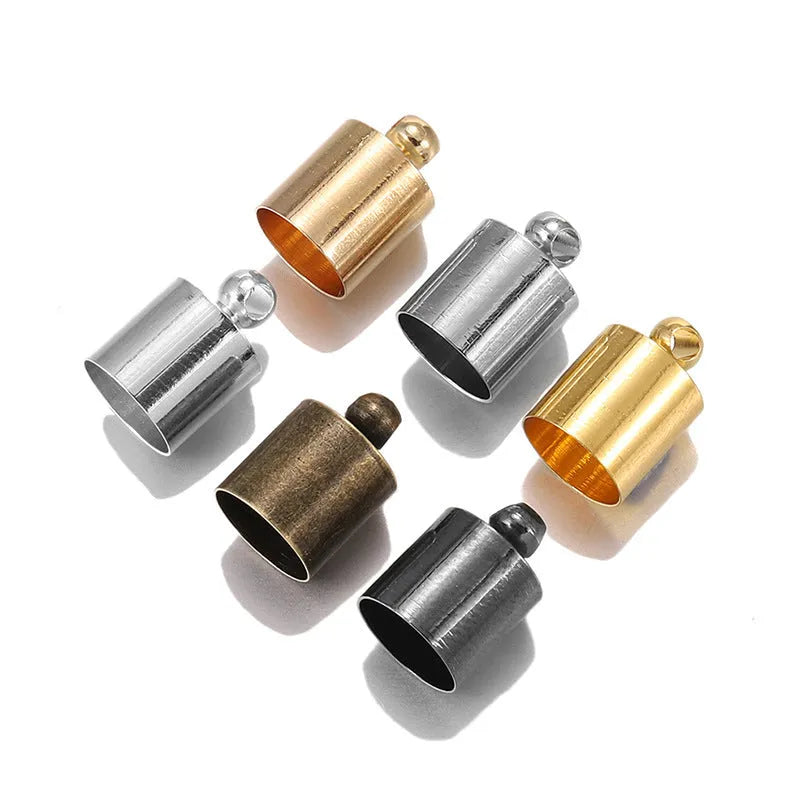 Assortment of small copper pendant weight caps in gold, silver, bronze, and black electroplated finishes.
