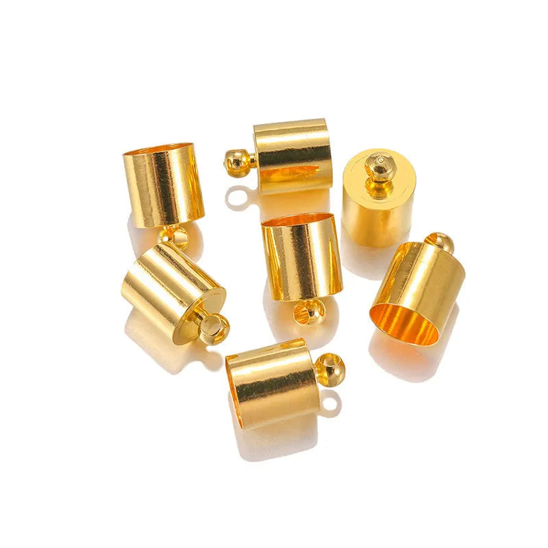 Assortment of small copper pendant weight caps in gold, silver, bronze, and black electroplated finishes.
