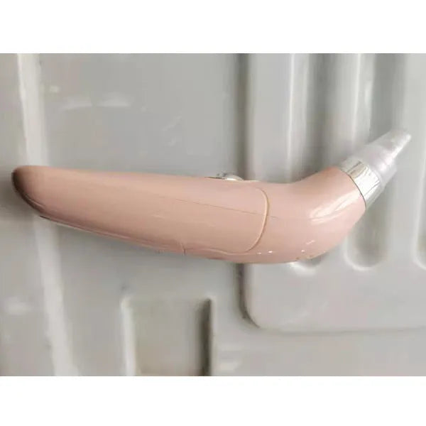 Electric blackhead pore cleaner in white and pink colours showing ultrasonic suction nozzle
