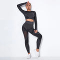 Woman wearing a seamless long-sleeved striped yoga suit in a stretch pose.