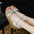Women's pink wedge sandals with thick heel, fish mouth open toe, and buckle closure
