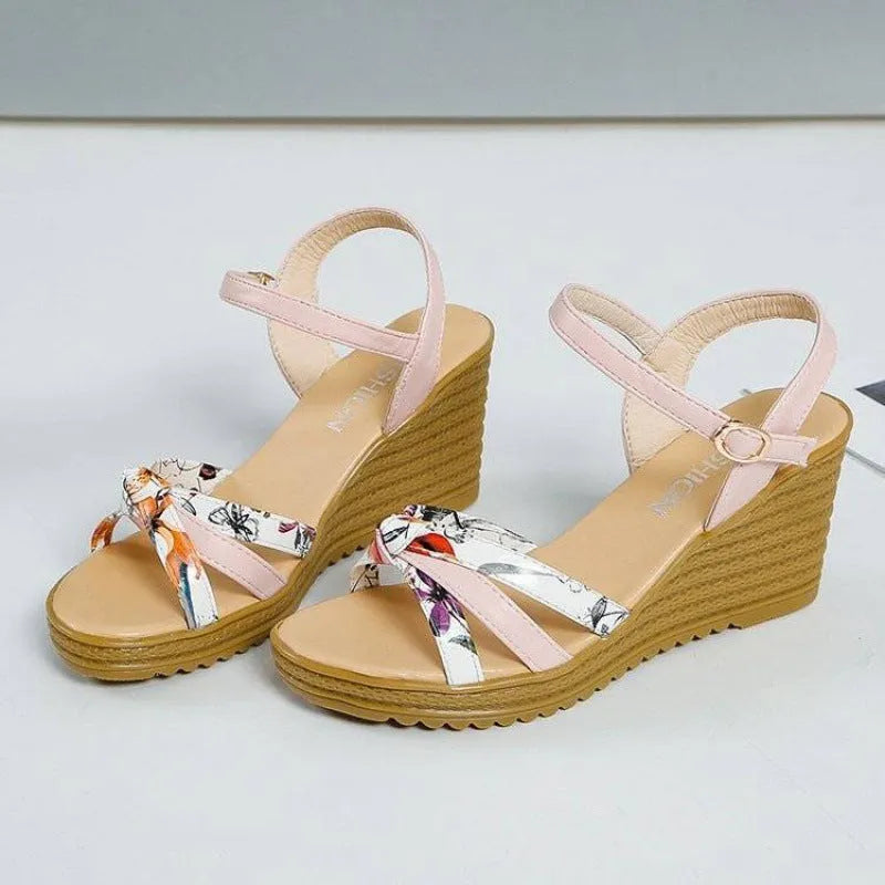 Women's pink wedge sandals with thick heel, fish mouth open toe, and buckle closure