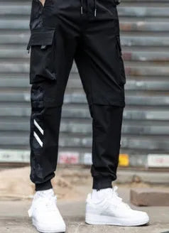 Men's straight-leg casual trousers in black nylon blend fabric with micro-elastic waist on a plain background