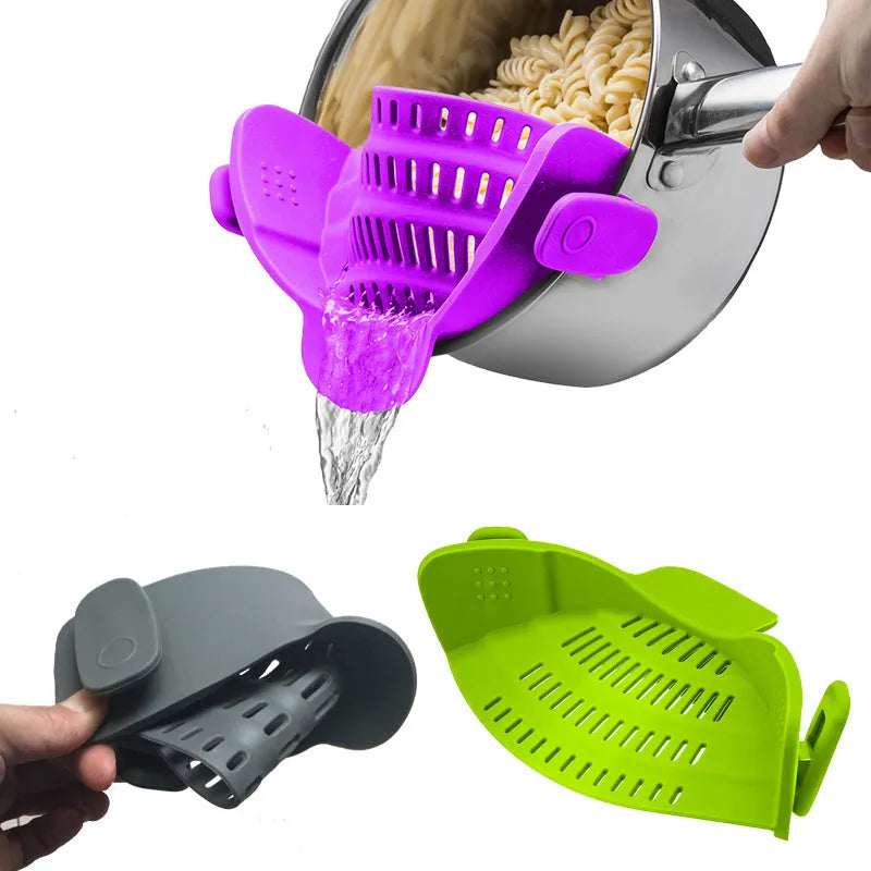 Silicone clip-on kitchen strainer with stainless steel filter mesh attached to a pot rim