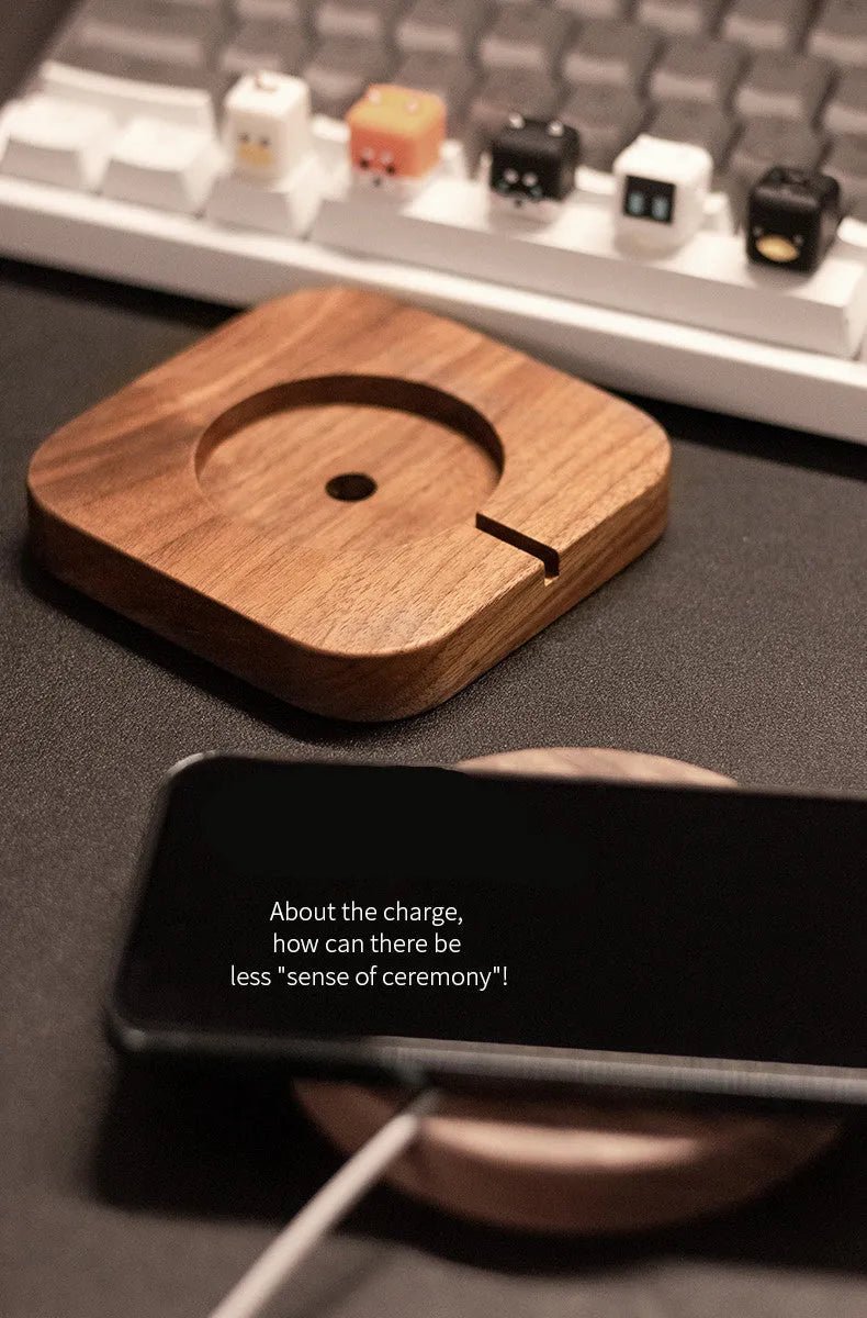 Walnut wood magnetic wireless charger bracket holding phone upright on desktop