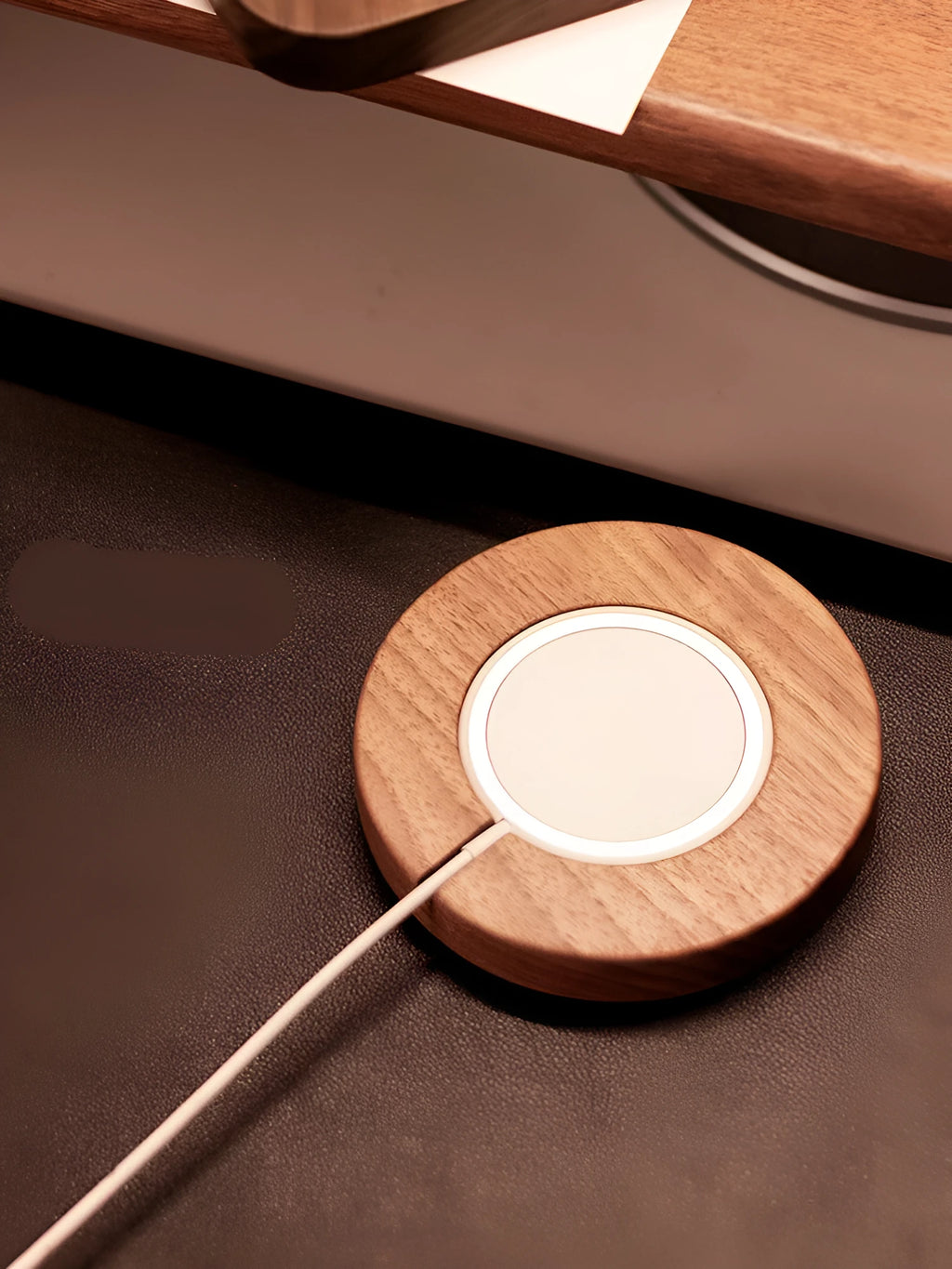 Walnut wood magnetic wireless charger bracket holding phone upright on desktop