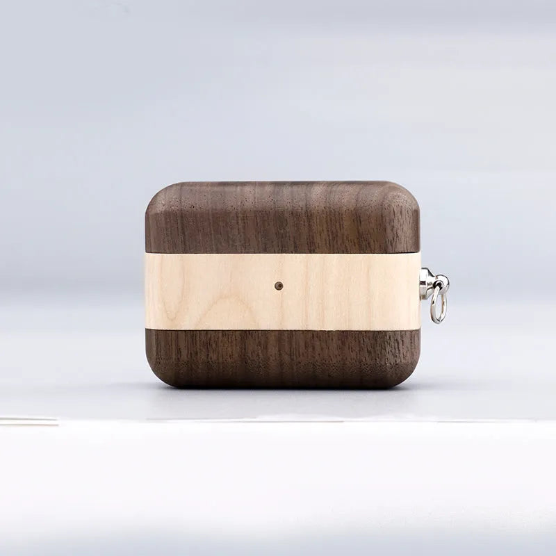 Bluetooth wireless earphones with a solid wood hard shell case and separate sleeve, compatible with Apple iPhones.