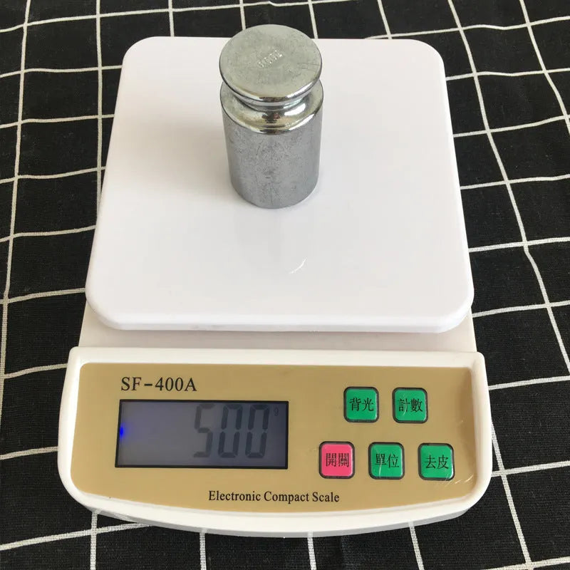 SF-400A black electronic kitchen scale on a counter with a bowl, showing a digital display.