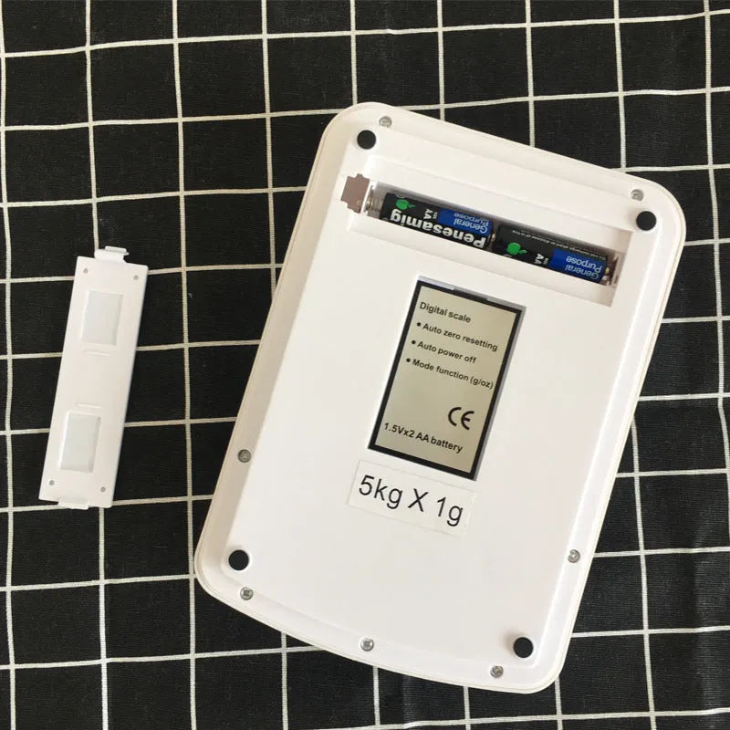 SF-400A black electronic kitchen scale on a counter with a bowl, showing a digital display.