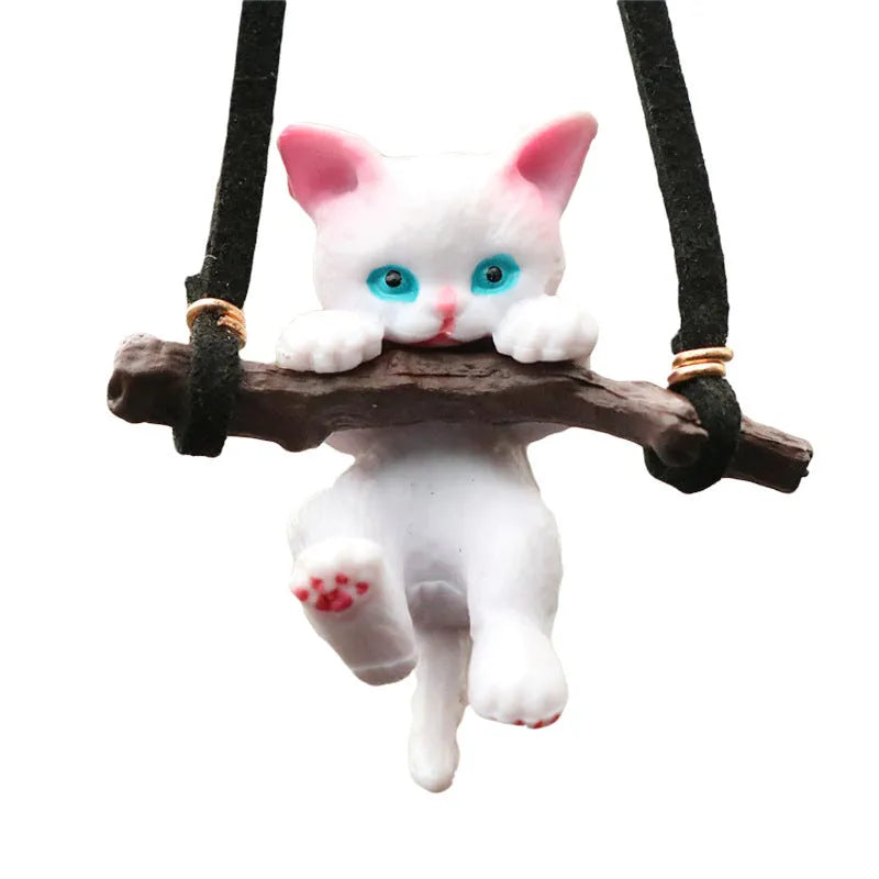 White non-woven fabric branch cat car ornament hanging from a rearview mirror with a traditional Chinese design