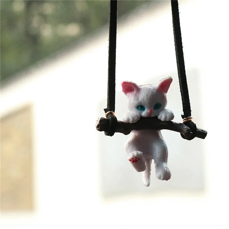 White non-woven fabric branch cat car ornament hanging from a rearview mirror with a traditional Chinese design