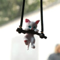 White non-woven fabric branch cat car ornament hanging from a rearview mirror with a traditional Chinese design