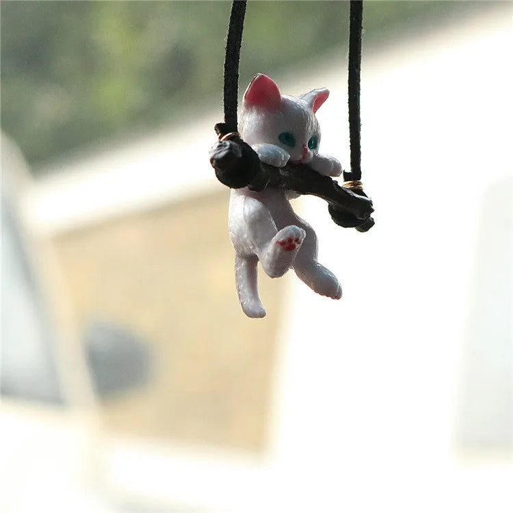 White non-woven fabric branch cat car ornament hanging from a rearview mirror with a traditional Chinese design