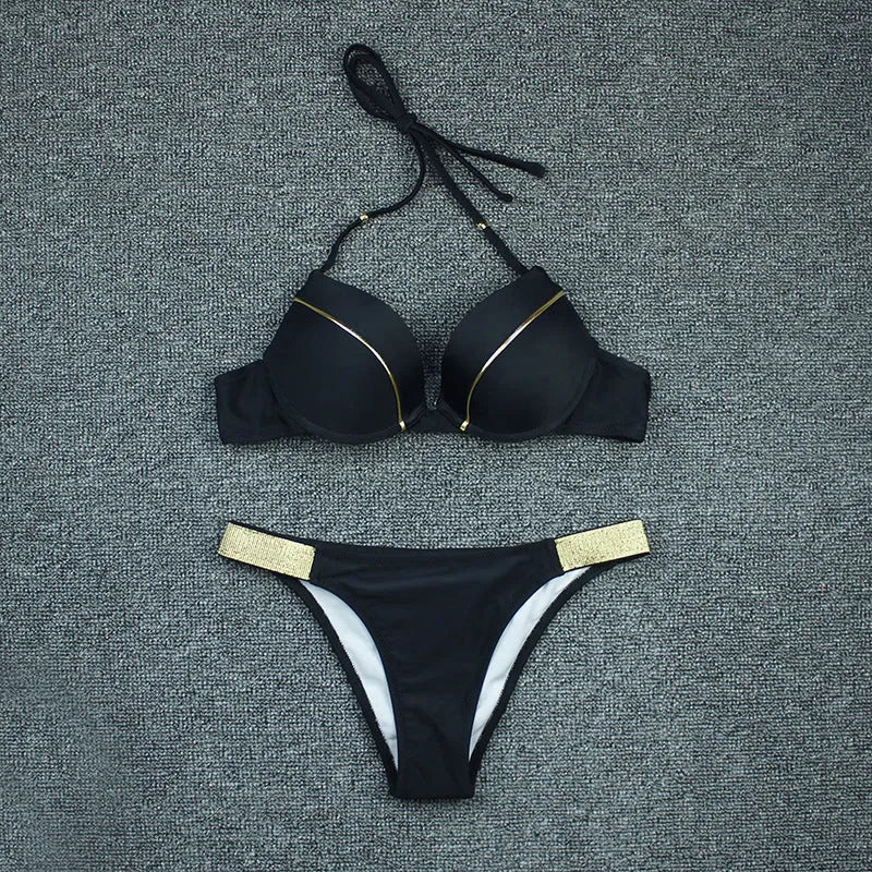 Nylon split bikini swimsuit with open back and solid colour, available in white, fuchsia, black, and navy blue, sizes S to XL.