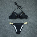 Nylon split bikini swimsuit with open back and solid colour, available in white, fuchsia, black, and navy blue, sizes S to XL.