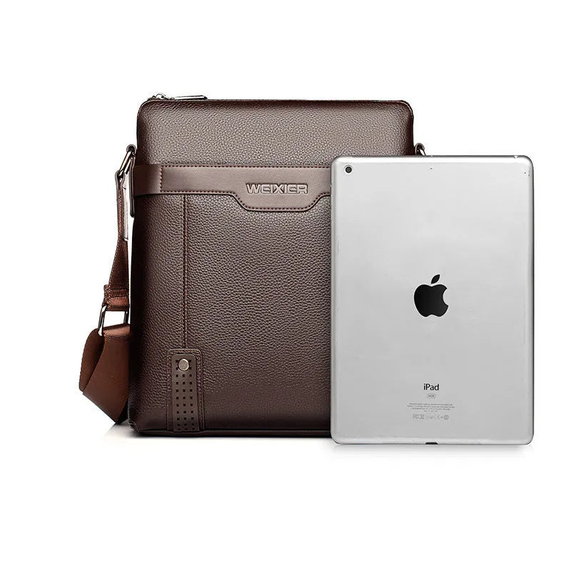 Men's medium black square shoulder bag made of PU leather with a zipper and single strap.