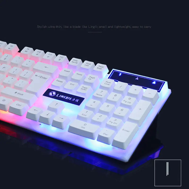 GTX300 black and white wired gaming keyboard and mouse set with coloured backlighting on a desk.