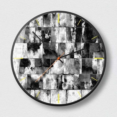 Round abstract art wall clock with metal frame in a mysterious black design, showing thin profile.