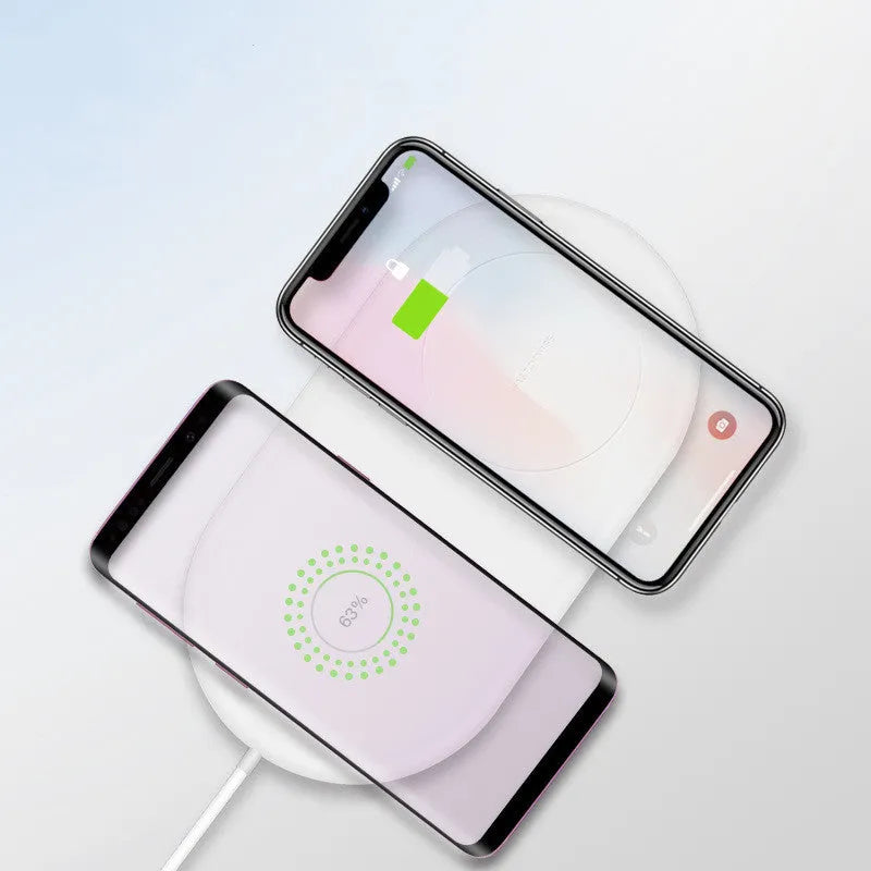 White wireless charging station for two smartphones with simple design supporting fast charging technology